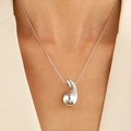 Polished silver teardrop pendant necklace worn with a blazer for a minimalist look - Silver Teardrop Necklace