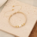 Detail of handmade woven seed bead bracelet with golden metal accents and cream pearls - 5#Beige