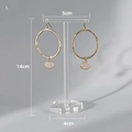 Gold hoop earrings with round charms displayed on a 14cm clear T-shaped acrylic stand - Transparent Large Hexagon Base
