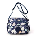 Waterproof nylon crossbody bag in dark blue with leaf prints and adjustable strap - Leaf Print