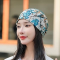 Floral print headscarf beanie in blue and beige tones shown on a side-view model - M (56-58cm) / Blue Narcissus