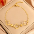 Elegant gold titanium steel bracelet featuring hollow clover charms and faceted beads - Gold Hollow Four Leaf Flower Bead