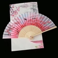 Detail of pink gradient Chinese folding fan with peach blossom ink art and pink tassel - Pink Eternal Love Peach Blossom