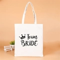 White canvas Team Bride tote bag with crown design for bachelorette parties - Black Crown Team Bride