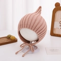 Detailed macro of pink ribbed knit baby pixie hat with chin straps for ear protection - 46-48cm (6-15 Months) / Pink