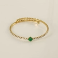 Detail of 18k gold plated stainless steel cuff featuring emerald green square gemstone - Peacock Green (Green Zirconia)