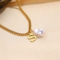 Elegant gold chain necklace featuring a polished letter S pendant and a baroque white pearl - Letter S Necklace