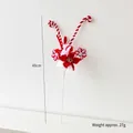 Red and white plush Christmas tree spray featuring poinsettia, snowflake, and ball - Snowflake Ball Pick
