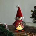 Close-up of glowing penguin gnome plush with LED light and red knit holiday accessories - Red Hat LED Glowing Penguin
