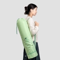 Light green yoga mat bag with drawstring closure and bottom wet pocket detail - Green