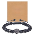 Close-up of black matte beaded lion head bracelet with greeting card for son - To My Man