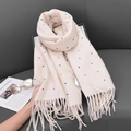 Beige knitted scarf with colorful polka dots and fringe, styled on a dark leather sofa - 68-180CM / Cream White