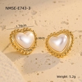 Macro detail of heart earrings with baroque pearls and golden beads on stone - Beaded Edge Pearl Heart Style (NMSE-E743-3)
