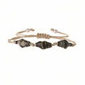 Detail of bohemian woven bracelet with brown patterned ceramic beads and beige cord - Ultramarine Blue