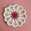Handmade crochet flower coaster in gradient red and blue with white scalloped edge - No. 2 Gradient