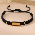 Detail of adjustable black woven rope bracelet with polished gold metal plate bar - Black (Gold Plate)