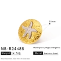 Detail showing 35mm stainless steel gold disc with silver starfish and hammered texture - Gold Hammered Disc Silver Starfish Ring (NB-R24488)