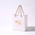 White paper thank you gift bag with gold cord handles for weddings and parties - 13x8x15cm / White + Champagne Handle