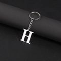 Polished stainless steel keychain featuring a silver-tone metal letter H pendant - Letter H