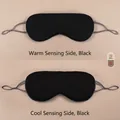Dual-sided black sleep mask featuring cooling and warming sides for restful sleep - Black