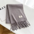 Grey thick wool scarf with fringes and minimalist brand label on a white surface - Fish Tail Grey / Over 175cm