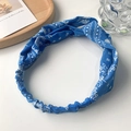 Vintage navy paisley wide knotted headband with elastic band on wooden tray - Blue