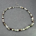 Close-up of irregular natural stones on a beaded necklace with stainless steel clasp - Green Ghost Quartz