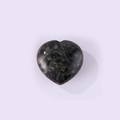 Polished heart-shaped natural stone ornament in dark green mottled pattern on white background - Sparrow Stone