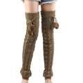 Macro shot of thick cable-knit leg warmers with fuzzy pom-poms and ribbed textures - One Size / Khaki