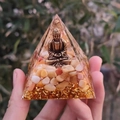 Handheld crystal resin pyramid with bronze Buddha statue and golden foil flakes inside - Style 19