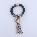 Llavero de pulsera con cuentas de leopardo, cuenta de madera y borla de cuero elegante - Estampado de leopardo