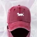 Close-up of embroidered puppy motif on burgundy washed cotton baseball cap texture - One Size / Burgundy