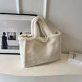 Minimalist creamy white plush tote bag with soft faux fur texture for winter fashion - Off White