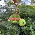 Handmade crochet turtle keychain with green shell and pink body on a golden metal ring - Keychain Pendant / Brown Green