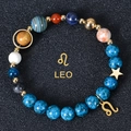 Macro detail of the Leo zodiac charm and 8mm solar system planetary beads bracelet - Leo