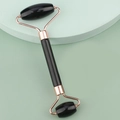Close-up of double-headed black facial jade roller with rose gold metal frame - Resin Double Head Roller Black
