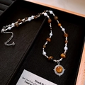 Tiger's eye heart pendant necklace with white beads on a black tray display - 42# Necklace-Silver