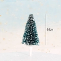 Detailed view of a 5.6cm mini Christmas tree cake topper with snow effect and white base - Simple Dark Green Cedar Tree Style