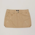 Dettaglio minigonna di jeans kaki con motivo a macchie d'inchiostro e borchie a croce - XS / Deserto