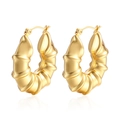 Chic 18K gold hollow bamboo earrings with glossy croissant texture on white backdrop - Bamboo Hollow Gold