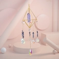 Detail of amethyst crystal suncatcher with gold geometric frame and teardrop pendant - Blue Crystal