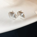 Macro shot of silver geometric square earrings with matte brushed texture on silk - Geometric Square Brushed Ear Buckle (19#)