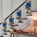Close-up of blue ribbon and silver foliage on Christmas stair garland with LED lights - Blue (No LED)