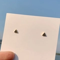 Minimalist golden triangular stud earrings featuring black crystal accents on card - 925 Silver Needle / Gold Triangle Stud Earrings