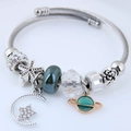 Stainless steel celestial charm bangle with green beads, moon and star pendants - Green