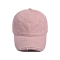 Detailed view of the distressed cotton fabric and worn edges on a pink baseball cap - Adjustable: 56-60cm / Pink