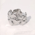 Polished silver floral open ring with 3D five-petal flower design on white stone - Steel