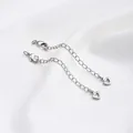 Close-up of silver extension chain with lobster clasp and hollow heart pendant for DIY jewelry - White Gold Color Hollow Heart