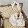 Off-white seersucker tote bag with colorful embroidered bows and adjustable strap - Beige