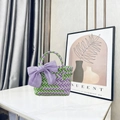Purple and green woven basket bag featuring a large lavender ribbon bow on the side - Small (With Purple Bow) / Green Purple